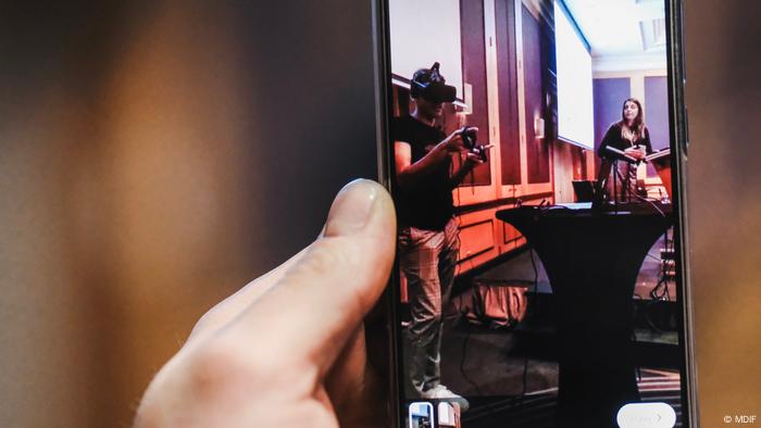 A smartphone screen shows the presentation of VR gear