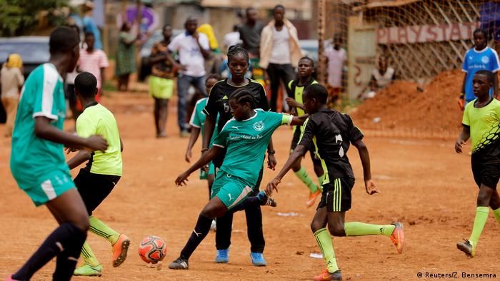 Girls playing football (Reuters/Z. Bensemra)