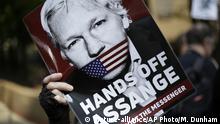 FILE - In this May 1, 2019, file photo, protesters demonstrate outside court where Julian Assange will appear in London. The Justice Department has charged Assange with receiving and publishing classified information. The charges are contained in a new, 18-count indictment announced May 23, 2019. (AP Photo/Matt Dunham, File) |