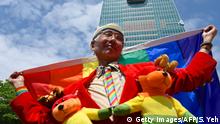 Taiwan gay activist Chi Chia-wei poses for photos in front of Taipei 101 tower during a wedding ceremony in Shinyi district in Taipei on May 24, 2019. (Photo by Sam YEH / AFP) (Photo credit should read SAM YEH/AFP/Getty Images)