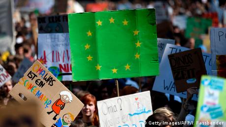 Fridays for Future protest, featuring a green European Union placard 