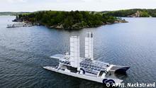 An aerial picture taken on May 28, 2019 shows the self-energy producing multihull Energy Observer sailing off the coast of the Swedish capital, Stockholm. - The high-tech catamaran, part of a project aimed at finding new solutions in favour of energy transition, is on a trip around the world during six years -from 2017 to 2022- with 50 countries expected to be visited along the way. (Photo by Jonathan NACKSTRAND / AFP)