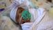A tiny baby wrapped in a blanket (Photo by HO / Sharp HealthCare. / AFP) / A tiny baby wrapped in a blanket (Photo by HO / Sharp HealthCare. / AFP) /