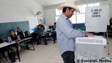 02.06.2019 *** A voter casts his ballot at a polling station during midterm elections in San Andres Azumiatla, in Puebla state, Mexico June 2, 2019. REUTERS/Imelda Medina