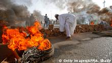 Sudanese protesters close Street 60 with burning tyres and pavers as military forces tried to disperse the sit-in outside Khartoum's army headquarters on June 3, 2019. - At least two people were killed Monday as Sudan's military council tried to break up a sit-in outside Khartoum's army headquarters, a doctors' committee said as gunfire was heard from the protest site. (Photo by ASHRAF SHAZLY / AFP) (Photo credit should read ASHRAF SHAZLY/AFP/Getty Images)