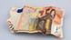 A crumpled 50-euro note A crumpled 50-euro note