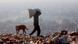 An Indian rag picker carries a sack of sorted recyclable materials at the Ghazipur landfill site in the east of New Delhi An Indian rag picker carries a sack of sorted recyclable materials at the Ghazipur landfill site in the east of New Delhi