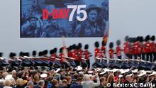 People participate in an event to commemorate the 75th anniversary of D-Day, in Portsmouth, Britain, June 5, 2019. REUTERS/Carlos Barria
