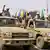 Integrantes das Forças de Apoio Rápido desfilam por Cartum