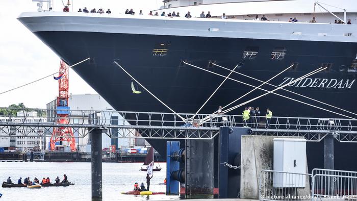 Environment activists block a cruise ship in Kiel harbor
