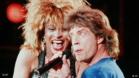Tina Turner performs with Mick Jagger at the Live Aid concert in Philadelphia in 1995