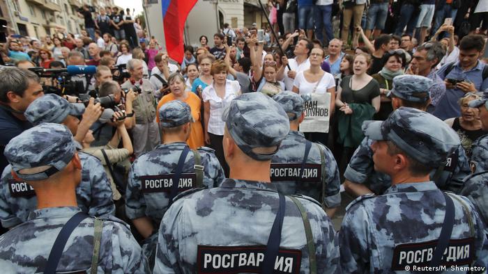 Members of Russia's National Guard block participants of a rally in support of Russian investigative journalist Ivan Golunov.