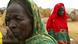 In this July 1, 2004 file photo, displaced Sudanese women are seen at a refugee camp in the Darfur region of Sudan In this July 1, 2004 file photo, displaced Sudanese women are seen at a refugee camp in the Darfur region of Sudan