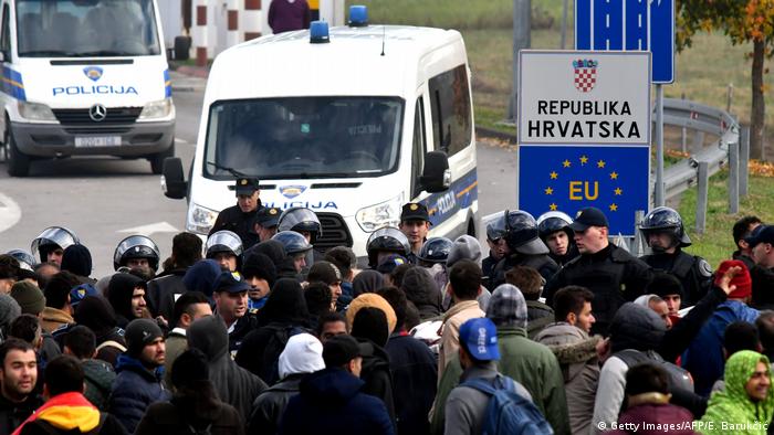 Police and migrants at Croatia-Bosnia border