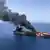 An oil tanker is on fire in the sea of Oman, Thursday, June 13, 2019