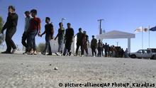 FILE - In this Sunday, Sept. 10, 2017 file photo, migrants from Syria walk towards a refugee camp at Kokkinotrimithia, outside of the capital Nicosia, in the eastern Mediterranean island of Cyprus. Cyprus' interior ministry says on Monday, Oct. 23, 2017, larger European Union member states should take on a fairer share of the burden by accepting more migrants for resettlement from other partners on the bloc's fringes that first receive them. (AP Photo/Petros Karadjias, File) |