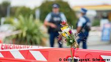 CHRISTCHURCH, NEW ZEALAND - MARCH 18: Flowers are seen in front of a police cordon at Linwood mosque on March 18, 2019 in Christchurch, New Zealand. 50 people were killed, and dozens are still injured in hospital after a gunman opened fire on two Christchurch mosques on Friday, 15 March. The accused attacker, 28-year-old Australian, Brenton Tarrant, has been charged with murder and remanded in custody until April 5. The attack is the worst mass shooting in New Zealand's history. (Photo by Kai Schwoerer/Getty Images)