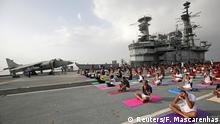 Members of the Indian Navy perform yoga on the flight deck of INS Viraat, an Indian Navy decommissioned aircraft carrier, during International Yoga Day in Mumbai, India, June 21, 2019. REUTERS/Francis Mascarenhas TPX IMAGES OF THE DAY
