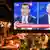 People watch a television in a restaurant as Istanbul mayoral candidates Binali Yildirim and Ekrem Imamoglu take part in a live television debate