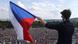 A demonstrator waves a Czech Republic flag during a protest rally demanding resignation of Czech Prime Minister Andrej Babis in Prague A demonstrator waves a Czech Republic flag during a protest rally demanding resignation of Czech Prime Minister Andrej Babis in Prague