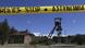 Police tape hangs near a mine shaft were two dead bodies were found in Cyprus Police tape hangs near a mine shaft were two dead bodies were found in Cyprus