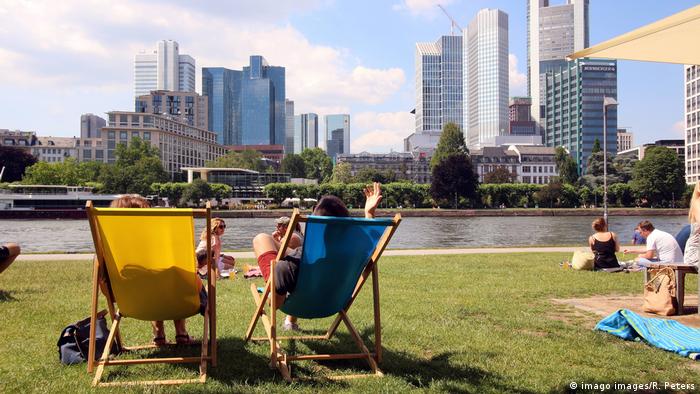 People sunbathing in Frankfurt, Germany