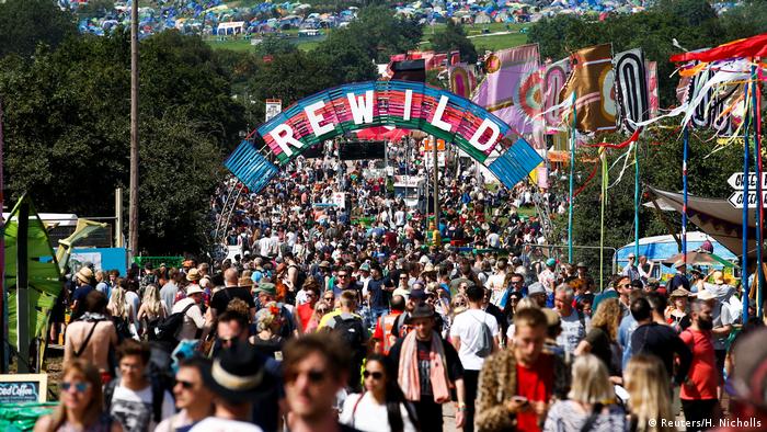 Glastonbury attendees walk along a track at the festival in Somerset, Britain, in June of 2019