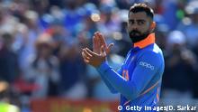 India's captain Virat Kohli gestures at end of play during the 2019 Cricket World Cup group stage match between West Indies and India at Old Trafford in Manchester, northwest England, on June 27, 2019. - India beat West Indies by 125 runs. (Photo by Dibyangshu Sarkar / AFP) / RESTRICTED TO EDITORIAL USE (Photo credit should read DIBYANGSHU SARKAR/AFP/Getty Images)