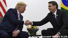 President Donald Trump, left, shakes hands with Brazilian President Jair Bolsonaro during a bilateral meeting on the sidelines of the G-20 summit in Osaka, Japan, Friday, June 28, 2019. (AP Photo/Susan Walsh) |