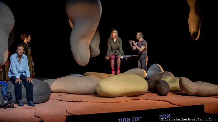 Actors onstage in a performance of 'To the End of the Land' in Tel Aviv