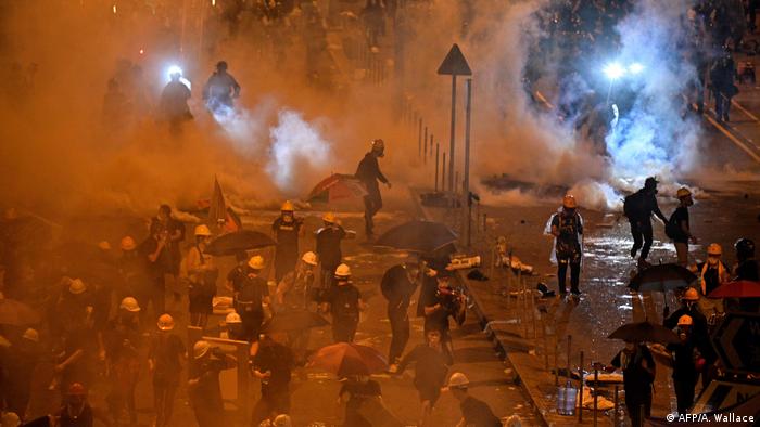 Police fire tear gas at protesters on July 1 in Hong Kong