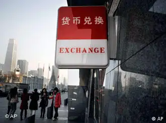 A currency exchange signboard is on display outside a bank in Beijing Monday, Nov. 30, 2009. Chinese Premier Wen Jiabao rebuffed an appeal from the European leaders Monday for faster reforms of currency policies that keep the yuan linked to the U.S. dollar, as summit meetings wrapped up without any major new initiatives. (AP Photo/Andy Wong)