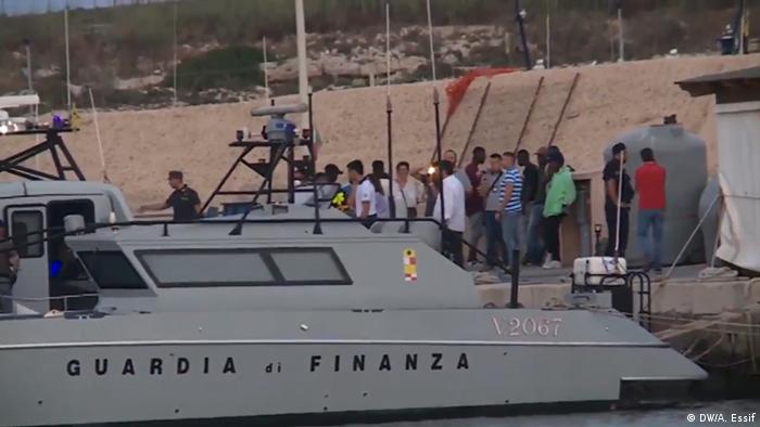 People going to shore in Lampedusa from a boat operated by Italian authorities