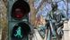 Statue of Theodor Fontane and a traffic light made to resemble the author Statue of Theodor Fontane and a traffic light made to resemble the author