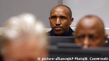 Bosco Ntaganda, a Congo militia leader, sits in the courtroom of the International Criminal Court (ICC) during the closing statements of his trial in The Hague, Netherlands, Tuesday Aug. 28, 2018. Ntaganda is facing charges of war crimes and crimes against humanity allegedly committed in the eastern Ituri region of Congo from 2002-2003. (Bas Czerwinski/Pool via AP) | 