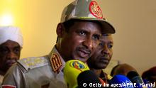 Sudan's deputy chief of the ruling military council General Mohamed Hamdan Dagalo gives a press conference in Khartoum in which they announced ruling generals and protest leaders have reached an agreement on the disputed issue of a new governing body on July 5, 2019. - The landmark agreement came after two days of talks following the collapse of the previous round of negotiations in May over who should lead the new ruling body -- a civilian or soldier. The two sides agreed on establishing a sovereign council with a rotating military and civilian (presidency) for a period of three years or little more, African Union mediator Mohamed El Hacen Lebatt told reporters. (Photo by Ebrahim Hamid / AFP) (Photo credit should read EBRAHIM HAMID/AFP/Getty Images)