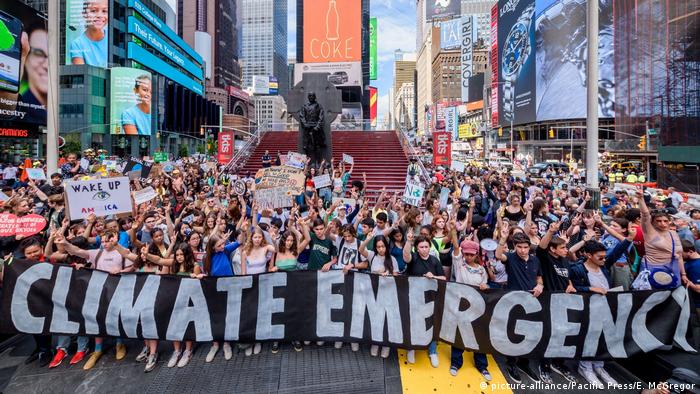 Protesters in New York demand climate emergency by carrying a huge banner