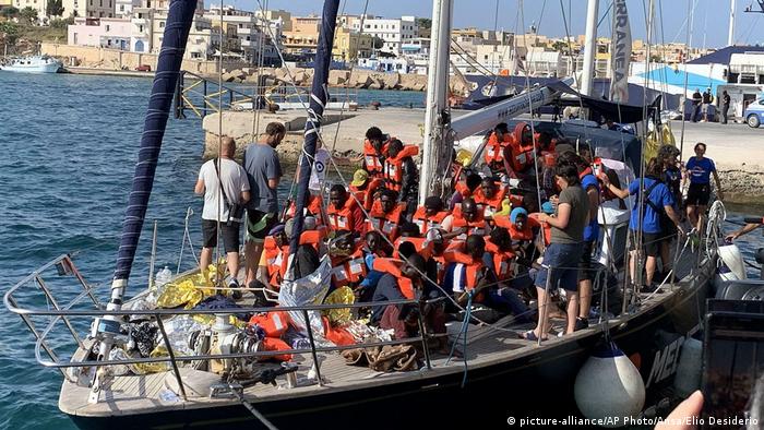 Migrants docking in Lampedusa