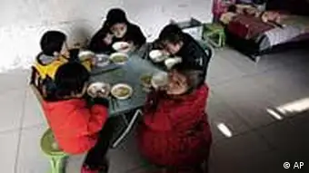 Children infected with HIV having their meals at an orphanage run by the Fuyang AIDS Orphan Salvation Association (AOS) in Fuyang in central China's Anhui province, Monday, Nov. 30, 2009. Tomorrow Dec. 1 is the World Aids Day. (AP Photo)