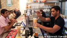 Randy Rampersand, founder of the Green Vic, serves drinks at a pub in London aiming to be the world's most ethical pub, in Shoreditch, London, Britain July 5, 2019. Picture taken July 5, 2019. REUTERS/Simon Dawson