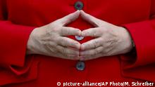 The hands of German Chancellor Angela Merkel are pictured as she arrives for the opening of the James-Simon-Galerie in Berlin, Friday, July 12, 2019. The James-Simon-Galerie is the new central entrance building for Berlin's historic Museums Island and will officially open on Friday, Jul 12, 2019.(AP Photo/Markus Schreiber) |