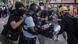 Protesters clash with police after taking part in a march against mainland Chinese parallel traders in the Sheung Shui district on July 13 Protesters clash with police after taking part in a march against mainland Chinese parallel traders in the Sheung Shui district on July 13