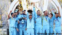LONDON, ENGLAND - JULY 14: England Captain Eoin Morgan lifts the World Cup with the England team after victory for England during the Final of the ICC Cricket World Cup 2019 between New Zealand and England at Lord's Cricket Ground on July 14, 2019 in London, England. (Photo by Michael Steele/Getty Images)