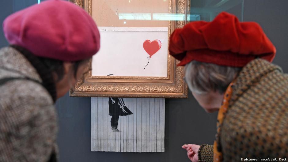 Banksy′s ′Love is in the bin′ goes under hammer | All media content | DW - Vimarsana News
