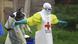 Two health workers in protective clothing Two health workers in protective clothing