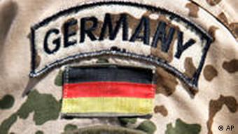 The ISAF logo on the sleeve of a German soldier's uniform