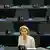 Ursula von der Leyen listens to a European Parliament debate
