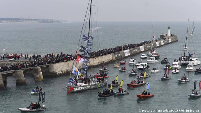 Queguiner - Leucemie Espoir as he crosses the finish line and finishes fifth in the Vendee Globe solo around-the-world sailing race on January 25, 2017.