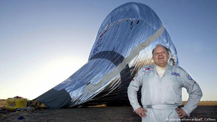 US pilot Steve Fossett poses in front of his Bud Light Spirit of Freedom balloon shortly after touching down in the Australian outback northeast of Birdsville, 04 July 2002.