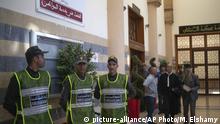Security forces stand guard outside a court room before the start of a final trial session for suspects charged in connection with killing of two Scandinavian tourists in Morocco's Atlas Mountains, in Sale, near Rabat, Morocco, Thursday, July 18, 2019. The three main defendants in the brutal slaying of two female Scandinavian hikers have asked for forgiveness from Allah ahead of a verdict. (AP Photo/Mosa'ab Elshamy) |